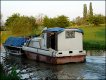 Working narrow boat tug and barge near Long Buckby Wharf R1_04628.JPG Working narrow boat tug and barge near Long Buckby Wharf R1_04628.JPG