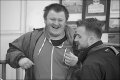 Two young men sharing a joke Exeter bus station DSC00637.JPG