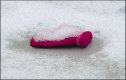 Red childs mitten in snow on pavement TZ70 P1030144.JPG