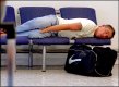 Man sleeping on chairs at Gatwick airport NIK_0759.jpg