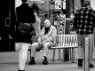 Man on bench in High Street Exeter _1040546.JPG