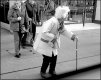 Old woman with stick crossing road Exeter GX7 P1140316.JPG Old woman with stick crossing road Exeter GX7 P1140316.JPG