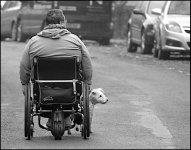 Wheelchair in the middle of the road with dog Exeter P1011816.JPG
