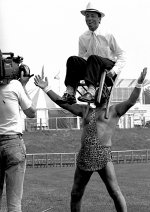 Strongman holding up Reporter on chair with his teeth Mamiya C330f.jpg Strongman holding up Reporter on chair with his teeth Mamiya C330f.jpg