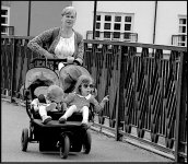 Mother with two children in pushchair crossing bridge DSC01581.JPG