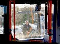 Man at bus stop through windscreen DSC02361.JPG