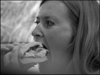Woman eating filled roll in bakeri Innsbruck Austria NIK_0916.JPG