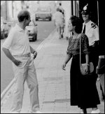 Pedestrians and policeman sharing a joke Olympus OM1 1993 04-13.jpg