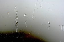 Running raindrops on window 12CL8838.JPG