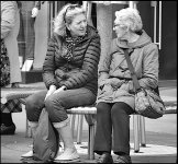 Two women on bench High Street Exeter G9 P1012192.JPG