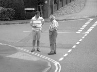 Younger and older men on Sidmouth suburb corner SL300 DSCF3372.JPG