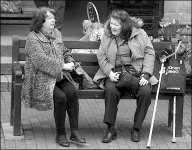 Two women talking on bench Sidmouth Market DSC00427.jpg