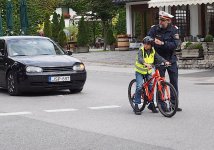 Policeman teaching boy road safety in Seefeld P9150039.jpeg