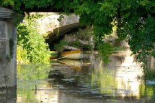 Bassac Canoe Under Bridge.jpg