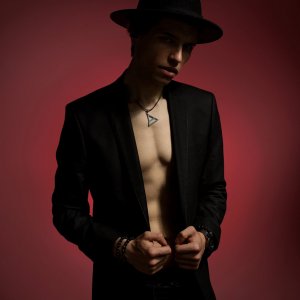 Male chest in suit and hat