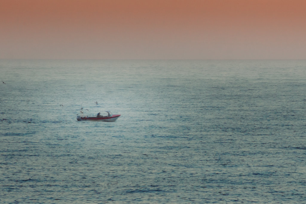 Isolated boat off the coast of Cromer