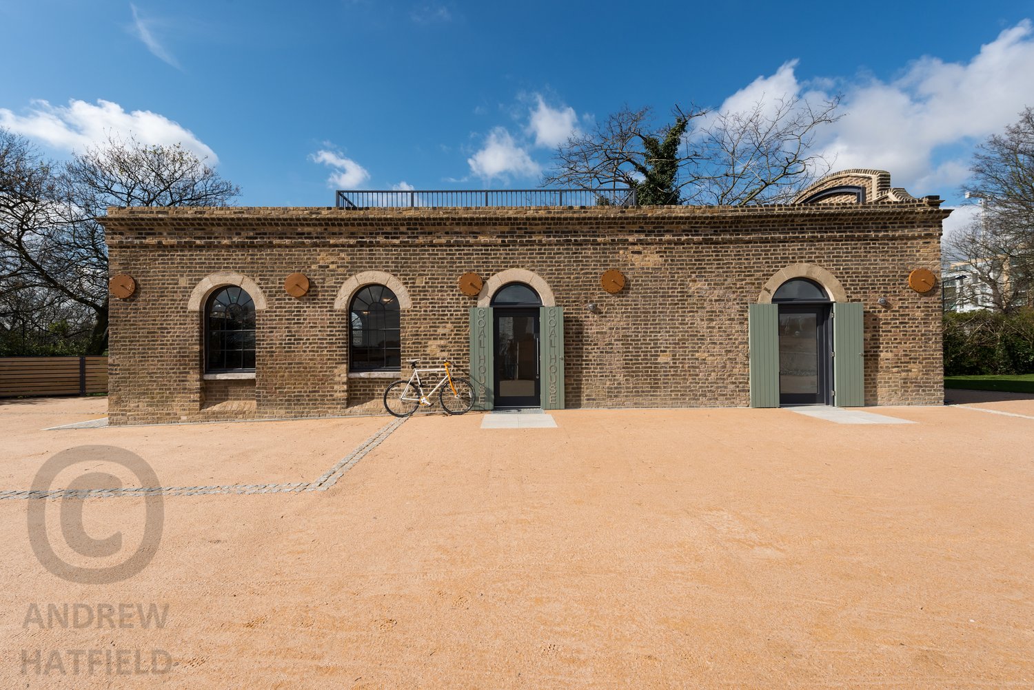 Architectural+image+award+winning+Coal+House+cafe+conversion+Woodberry+Wetlands+Stoke+Newington+brick+front+elevation+arched+windows+blue+sky+by+Andrew+Hatfield+architectural+photography+London+AH8_8935.jpg