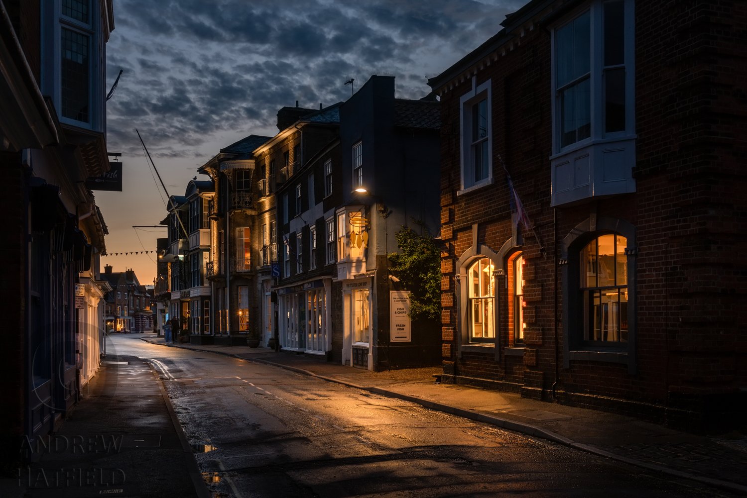 Architectural+image+showing+Southwold+High+Street+ay+night+looking+West+at+twilight+with+wet+roads+by+Andrew+Hatfield+AH9_5102.jpg